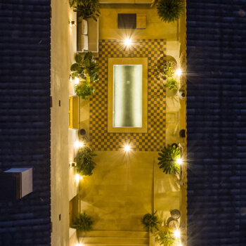 birds-eye-view-masia-cabellut-courtyard-lights-night